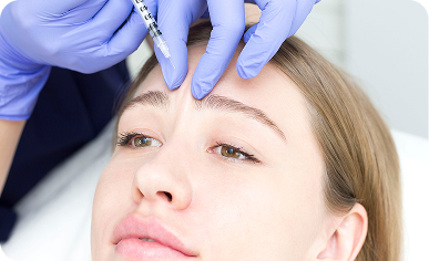 Physician performing a Botox injection on a patient's forehead at Desert Med Rejuvenation.